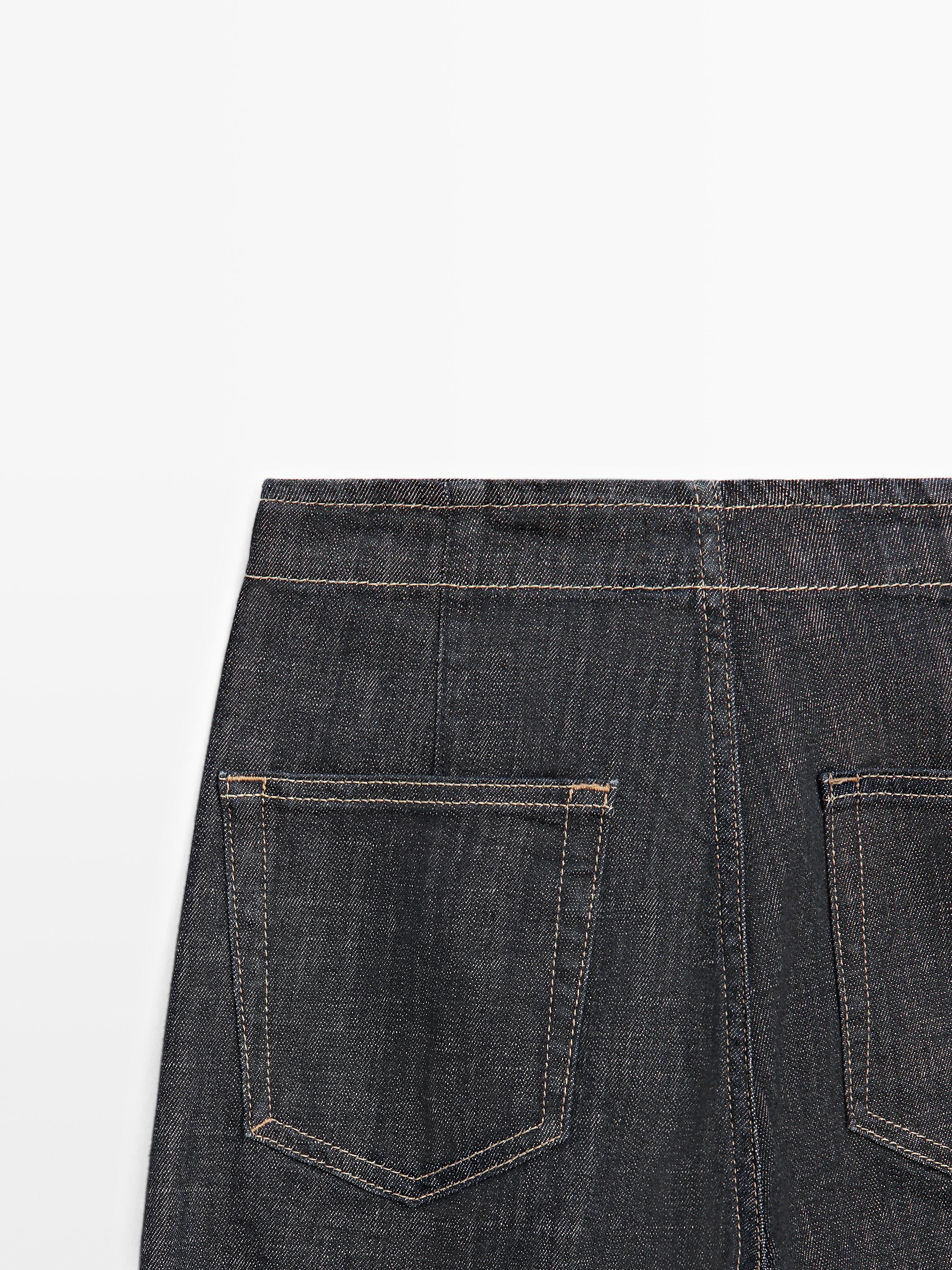 High-waist wide-leg jeans with chains